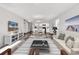 Open-concept living area with updated floors, a kitchen, and a dining space that flows into the living room at 500 Dundalk Dr., Conway, SC 29526