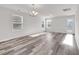 Large living area with light gray vinyl flooring and a glass panel rear exit door at 500 Dundalk Dr., Conway, SC 29526