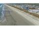 Aerial view showcasing the coastline and nearby town at 5000 N Ocean Blvd. # B-1, North Myrtle Beach, SC 29582
