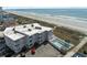 Aerial view of condo complex with pool, beach, and parking at 5000 N Ocean Blvd. # B-1, North Myrtle Beach, SC 29582