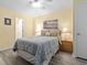 Relaxing bedroom with a comfortable bed, soft lighting, and coastal-themed art at 5000 N Ocean Blvd. # B-1, North Myrtle Beach, SC 29582