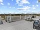 Outdoor deck area with picnic table and seating, perfect for relaxing at 5000 N Ocean Blvd. # B-1, North Myrtle Beach, SC 29582