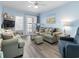 Bright living room with sofas, balcony access, and a relaxing atmosphere at 5000 N Ocean Blvd. # B-1, North Myrtle Beach, SC 29582