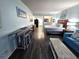 Open floor plan with bedroom, living area, modern decor and access to an outdoor balcony at 5300 N Ocean Blvd. # 106, Myrtle Beach, SC 29577