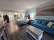 Cozy studio bedroom featuring a queen bed, blue couch, and modern decor for a relaxing stay at 5300 N Ocean Blvd. # 106, Myrtle Beach, SC 29577