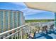 Relax on this balcony offering views of the property and the surrounding landscape at 5300 N Ocean Blvd. # 922, Myrtle Beach, SC 29572