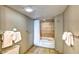 Bathroom featuring a tiled shower-tub combination, towel racks, and ample space at 5300 N Ocean Blvd. # 922, Myrtle Beach, SC 29572