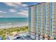 Exterior view showcasing a beachfront resort with ocean views, pool, and beach access at 5300 N Ocean Blvd. # 922, Myrtle Beach, SC 29572