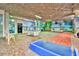 Indoor game room featuring shuffleboard, pool table, and colorful beach murals at 5300 N Ocean Blvd. # 922, Myrtle Beach, SC 29572