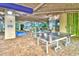 Fun game room with ping pong table, pool table, and beach-themed murals at 5300 N Ocean Blvd. # 922, Myrtle Beach, SC 29572