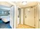 Hallway with a view of a bedroom, in-unit laundry closet, and entry door at 5300 N Ocean Blvd. # 922, Myrtle Beach, SC 29572