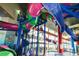 Indoor waterpark featuring multi-story slides, spiral staircase, mermaid mural and views of an inviting swimming pool at 5300 N Ocean Blvd. # 922, Myrtle Beach, SC 29572
