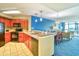 Open-concept kitchen featuring modern appliances, breakfast bar, and adjacent dining area at 5300 N Ocean Blvd. # 922, Myrtle Beach, SC 29572