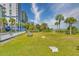 Well-maintained lawn featuring lounge chairs, a gazebo and palm trees by the beach at 5300 N Ocean Blvd. # 922, Myrtle Beach, SC 29572