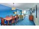 Open living area with a dining table and ocean views from the connected balcony at 5300 N Ocean Blvd. # 922, Myrtle Beach, SC 29572