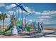 Beachfront playground with slides, climbing structures, and soft landing surfaces, perfect for ' outdoor activities at 5300 N Ocean Blvd. # 922, Myrtle Beach, SC 29572