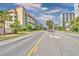 Street view of the condos with palm trees and greenery, adding to the coastal charm at 5300 N Ocean Blvd. # 922, Myrtle Beach, SC 29572