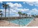 Outdoor swimming pool with clear blue water, palm trees, and comfortable lounge chairs providing a relaxing vacation atmosphere at 5300 N Ocean Blvd. # 922, Myrtle Beach, SC 29572
