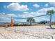 Ocean view sand volleyball court with blue net ready for recreational games and beachside fun on a sunny day at 5300 N Ocean Blvd. # 922, Myrtle Beach, SC 29572