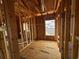 A room under construction with wood framing, wiring, and plumbing visible, showcasing the inner workings of the new home at 6001 - 5142 S Kings Hwy., Myrtle Beach, SC 29575