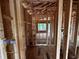 Open framed walls of an unfinished room with wiring and plumbing visible, showing the structural details of the new construction at 6001 - 5142 S Kings Hwy., Myrtle Beach, SC 29575