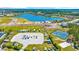 Aerial view of the expansive community RV parking area, tennis courts and a clear blue lake, offering something for everyone at 756 Waterbridge Blvd., Myrtle Beach, SC 29579