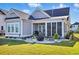 Beautiful backyard featuring a patio with seating, lush green grass, providing a perfect outdoor space for relaxation and entertainment at 756 Waterbridge Blvd., Myrtle Beach, SC 29579