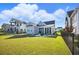 Spacious backyard showcasing a well-maintained lawn, fenced perimeter, creating a private outdoor oasis for relaxation and activities at 756 Waterbridge Blvd., Myrtle Beach, SC 29579