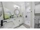 Elegant bathroom with white marble, cabinets, granite countertops, matte black finishes, and walk-in shower at 756 Waterbridge Blvd., Myrtle Beach, SC 29579