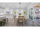 A dining area with table and chairs connects kitchen to an outdoor living area at 756 Waterbridge Blvd., Myrtle Beach, SC 29579