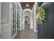 Elegant entryway featuring hardwood floors, French doors, and an open view into the home at 756 Waterbridge Blvd., Myrtle Beach, SC 29579