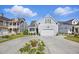 Charming home featuring a two-car garage, well-manicured lawn, and beautiful front yard landscaping at 756 Waterbridge Blvd., Myrtle Beach, SC 29579