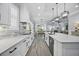 Open kitchen featuring a large island, stone countertops, and views of the dining and living areas at 756 Waterbridge Blvd., Myrtle Beach, SC 29579