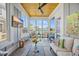 Stylish sunroom with views of the pond, wood ceiling, lots of windows, and gray paneled walls at 756 Waterbridge Blvd., Myrtle Beach, SC 29579