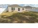 Large backyard featuring new construction with a white vinyl fence and a concrete patio at 884 Freestyle Ct., Longs, SC 29568