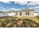 A spacious backyard features an outdoor concrete patio and a white fence at 884 Freestyle Ct., Longs, SC 29568