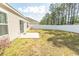 Spacious backyard featuring a well-maintained lawn and a secure white fence for privacy at 884 Freestyle Ct., Longs, SC 29568
