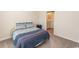 Carpeted bedroom with view into ensuite bathroom at 884 Freestyle Ct., Longs, SC 29568