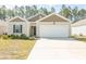 Charming one-story home with a well-manicured lawn and a two-car garage at 884 Freestyle Ct., Longs, SC 29568