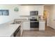 Modern kitchen with stainless steel appliances, white cabinets and countertops at 884 Freestyle Ct., Longs, SC 29568