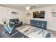 Comfortable living room with a large TV, modern decor, and stylish furnishings at 884 Freestyle Ct., Longs, SC 29568
