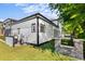 View of the backyard features a modern home with a grass yard at 100 Serenity Point Dr., Little River, SC 29566