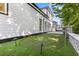 Backyard features green turf and modern black outdoor lighting at 100 Serenity Point Dr., Little River, SC 29566