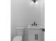 Clean and bright bathroom features black accents, vanity and toilet at 100 Serenity Point Dr., Little River, SC 29566