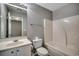 Full bathroom featuring a shower-tub combo, vanity with sink, and tiled flooring at 104 Barnacle Ln. # 3, Little River, SC 29566
