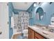 Bright bathroom with a single sink vanity, decorative wall hangings, and a bathtub with shower at 1046 Palisade Circle # 1046, Myrtle Beach, SC 29577