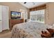 Bedroom with large window, TV, dresser and comfortable decor at 1046 Palisade Circle # 1046, Myrtle Beach, SC 29577