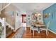 Charming dining area with wooden floors, coastal-themed decorations, and a view into the cozy living room at 1046 Palisade Circle # 1046, Myrtle Beach, SC 29577