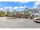Well maintained townhome featuring manicured landscaping, palm trees and plenty of parking for residents and guests at 1046 Palisade Circle # 1046, Myrtle Beach, SC 29577