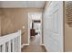 Upstairs hallway with closet that leads to a bedroom with a TV at 1046 Palisade Circle # 1046, Myrtle Beach, SC 29577